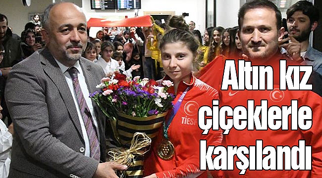 Altın kız çiçeklerle karşılandı