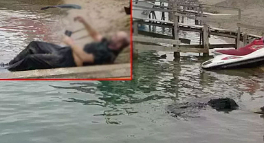 Elinde cep telefonu ile ırmaktan cesedi çıkartıldı