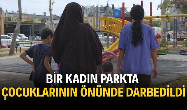 Bir kadın parkta çocuklarının önünde darbedildi