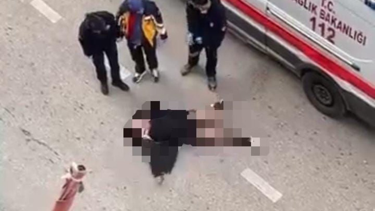 Yolun ortasında yatan kadın, sinir krizi geçirdi